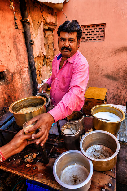 Indian chai vendor serving traditional tea at a roadside stall