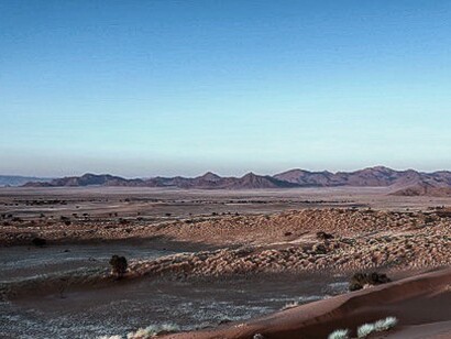 Namib-Naukluft National Park, Namibia. There are innumerable attractions, such as the Namib Naukluft its blue skies accentuated even more by the dust orange dunes that offer singular beauty and peace