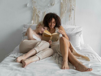 A couple enjoying the novel they are reading in the modern age