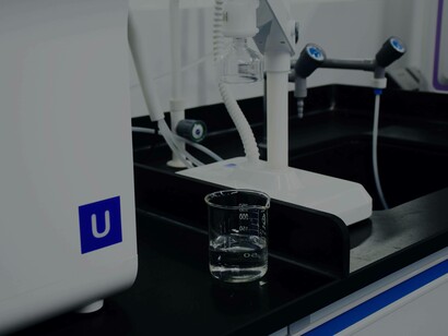 Water in a glass beaker ready to be applied for practical use concerning filtration