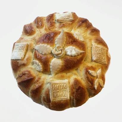 Bread, along with a wax candle and wheat dish, are important elements of Patron Saint's Day