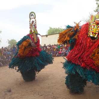 Hervé Youmbi, Bamiléké-Kwele Ku'ngang gorilla mask and single-faced rhino mask, during a ceremony in Fondanti village, 2019. Courtesy of San Antonio Museum of Art