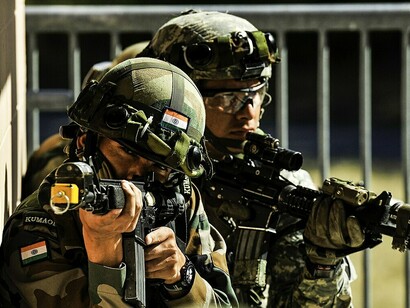 Indian Army soldiers from the 6th Battalion, Kumaon Regiment provide security while executing company movement procedures with the 1st Brigade, 2nd Infantry Division during Exercise Yudh Abhyas 2015 at Joint Base Lewis–McChord, Washington, US