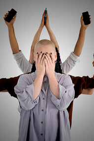 All the people are connected, using mobile phones, except for the girl in the foreground who is choosing to disconnect