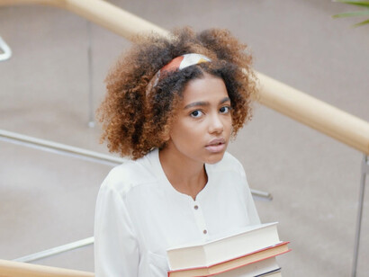 Amidst the books and knowledge, this student represents the need for universities to evolve their approaches to better prepare future leaders for global issues