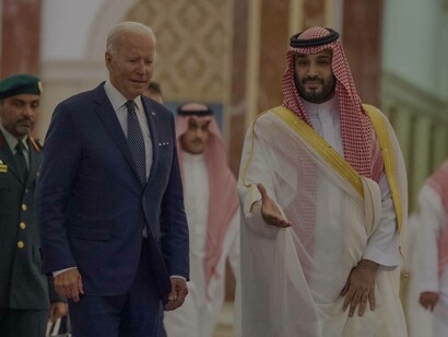 Mohammed bin Salman Al Saud ushering Joe Biden to his seat