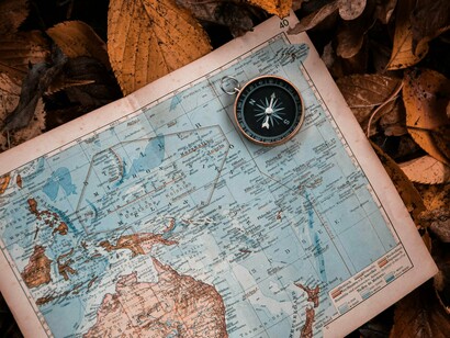 Tools of exploration, laid against nature’s floor, symbolize humanity’s eternal hunt for what’s been intentionally concealed