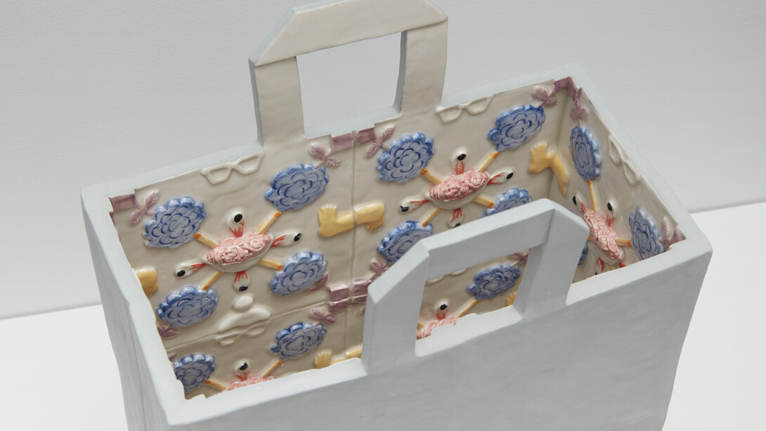 Wansoo Kim, A bag full of me, 2022, porcelain, 20x12x3.5 inches. Courtesy the artist and Red Arrow Gallery