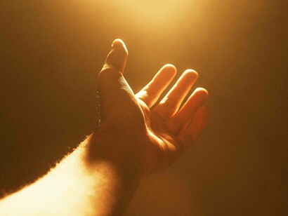 Reaching out a hand in the hopes that they will be saved and spared by God