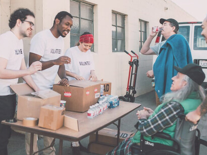 Young volunteers generously giving away food to help those in need