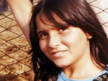Emanuela Orlandi leaning against a chained fence moments before her abduction in Italy