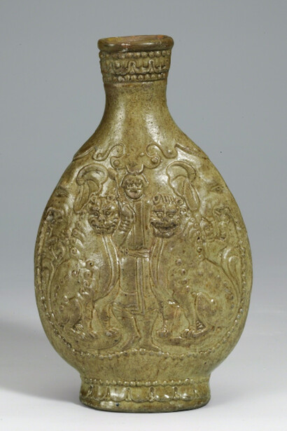 Unknown Artist, Yellow-green glazed flask with foreigner and lions, 550-577. Courtesy of China Institute Gallery