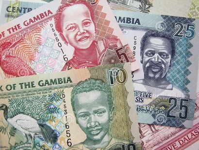 Moneda de Gambia. El dinero suele ser la solución...o el problema