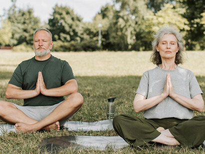 A man and a woman meditating