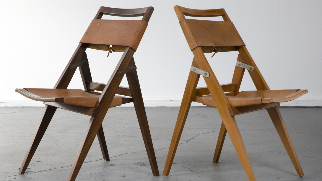 Folding chair with jacaranda frame and leather seat. Designed by Lina Bo Bardi for Studio de Arte Palma, Brazil, circa 1950. (seat height: 16.5") 17.75" L x 16.75" W x 32.25" H / 45.1cm L x 42.5cm W x 81.9cm H. Photo: Joe Kramm/R & Company.