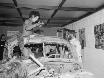 Traffic in Town, performance with Yoshio Nakajima, Jasper Grootveld, and Thom Jaspers, Galerie Honger, Schiedam, Netherlands, 1965. Courtesy of Match Gallery © photo Cor Jaring / Nakajima Family Archive