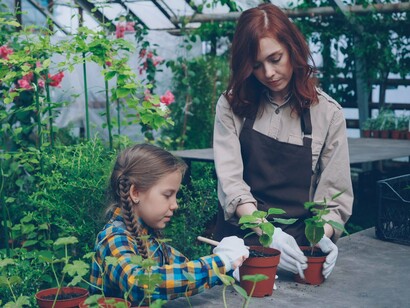 A family enjoying time in the garden, reflecting the value of staying active through meaningful daily tasks