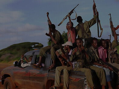 Interim Juba Administration forces drive into Kismayu, celebrating the successful rescue of hostages kidnapped by Al-Shabaab with the aid of AMISOM Kenya Defence Forces air surveillance