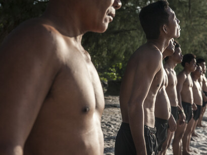 The UXO salvage diver team during training on the island of Koh
Rong off the coast of Sihanoukville, Cambodia, line up ahead of a
sea swim. All the divers were previously de-miners with the
Cambodian Mine Action Centre and were selected by the Golden
West Humanitarian Foundation from a group of over forty
applicants