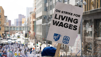 Educators from Minneapolis schools march through downtown Minneapolis, USA