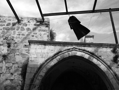 Kathryn Cook, A priest's frock hands out at an Armenian abbey in Jerusalem.