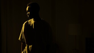 Person standing alone in the dark 