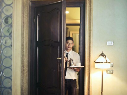 A man working in the hospitality industry overseas