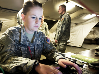U.S. Army Pfc. Hannah Quaney of the Colorado Army National Guard takes part in a training exercise during Immediate Response 2014 in Postojna, Slovenia, on August 27, 2014. Led by U.S. Army Europe, the combined joint tactical field exercise was designed to strengthen interoperability among NATO, Croatia, and regional partner nations