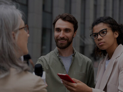 A diverse group conducting a journalism interview, embodying the essence of media engagement and storytelling