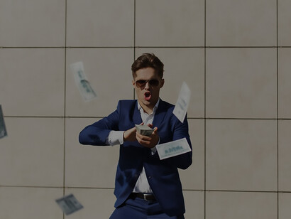 Watch as a young businessman joyfully dances on the street, playfully tossing dollars in the air, exuding energy and enthusiasm