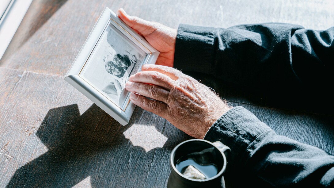 Person holding a photograph