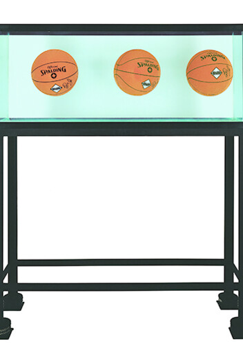 Three Ball Total Equilibrium Tank_(Dr. J Silver Series), 1985. Glass, steel, distilled water, sodium chloride reagent, three basketballs, 60 1/2 x 48 3/4 x 13 1/4 inches 153.7 x 123.8 x 33.7 cm © Jeff Koons
