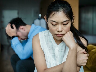 Tension rises as a couple argues on the sofa, struggling to understand each other