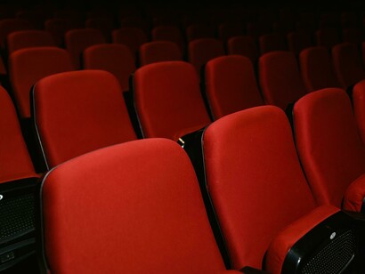 In the AI-penned script, the setting is an abandoned movie theater filled with empty seats