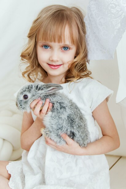 Happy girl with her rabbit. We must focus on our present day and the things we have, to find happiness