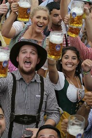 People celebrate Oktoberfest in traditional outfits