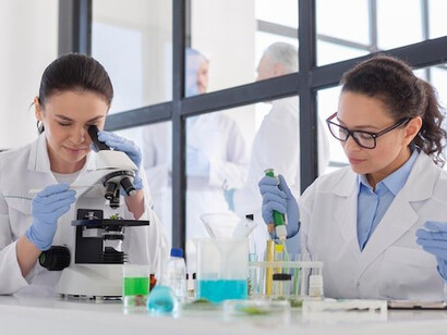 Scientists working with chemical substances exemplify the importance of science communication in research and development, guided by scientific advisors to ensure their work effectively informs and benefits society