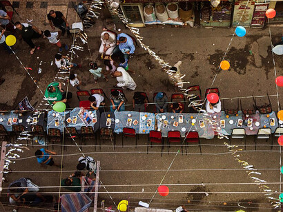 In Cairo, Egypt, Muslims come together at sunset during Ramadan to join the Mataraya Iftar, one of the largest free iftar gatherings in the world