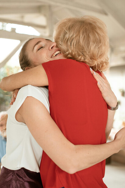 Women hugging each other tight