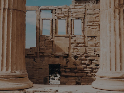 Two brown columns amidst ruins in Athens, Greece