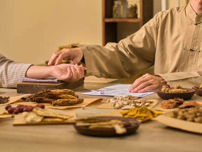 A professional Ayurvedic practitioner preparing healing spices — where ancient wisdom meets modern wellness