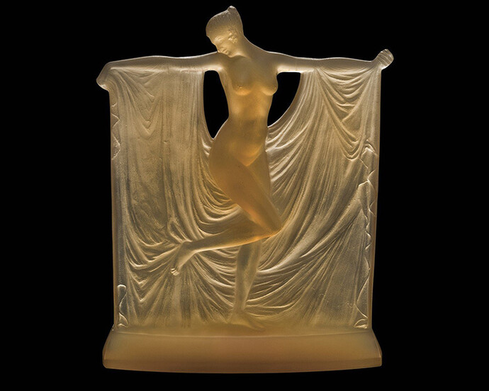 René Lalique, Designer, Lalique et Cie,, Manufacturer, Suzanne
Statuette: transparent butterscotch yellow glass; mold-pressed, acid-etched.
Designed 1925