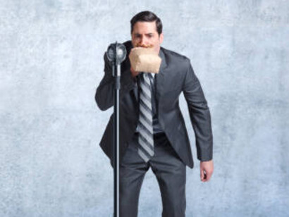 A businessman overcoming the fear of public speaking symbolizes personal growth and the courage to face challenges head-on