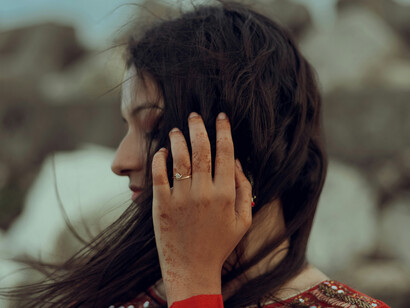 The wind caresses a young woman's hair