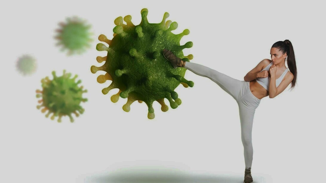 A woman kick-boxes the Covid-19 virus away
