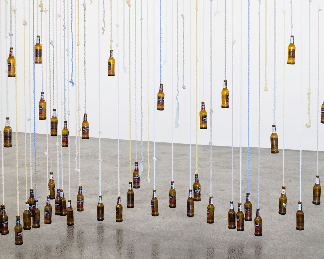Divider, 2016 Knotted fabric, and beer bottles Dimensions approx. 210 x700 x340 cm