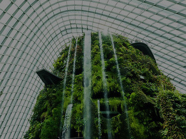 Unveil the essence of biophilic design in this architectural gem, where a flower dome garden and verdant greenhouse forest converge, epitomizing the perfect union between nature and contemporary architecture