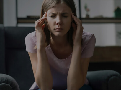 Capture the raw reality of a beautiful woman experiencing an anxiety attack at home, depicting the struggles of Obsessive-Compulsive Disorder (OCD) and anxiety disorders