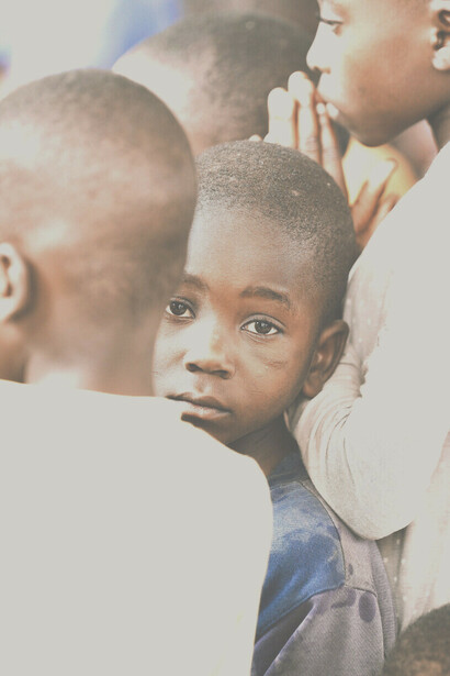 Hungry eyes of a Tanzanian boy villager