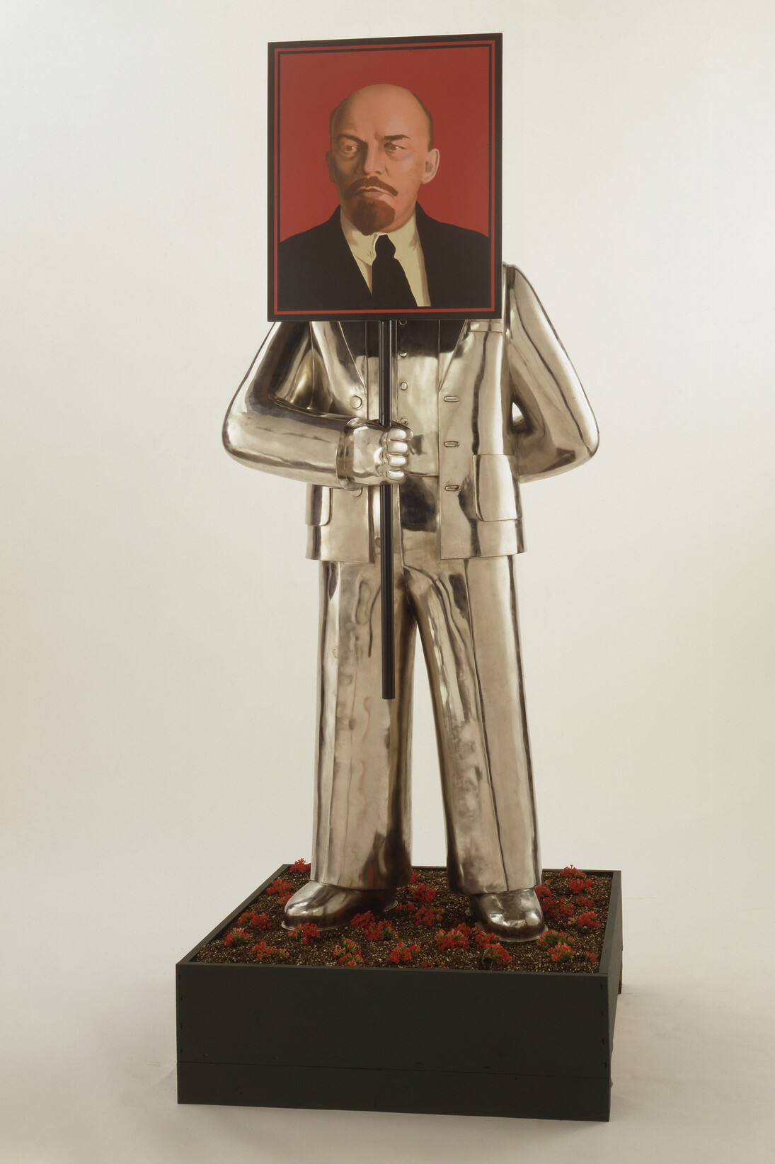 Grisha Bruskin, Man with Portrait of Lenin, From the series Paradise Lost, 1990, Installation, stainless steel, aluminum, industrial enamel, 200 x 86.4 x 68.5 cm, © Grisha Bruskin, 1990, Image courtesy of the Sepherot Foundation, Liechtenstein